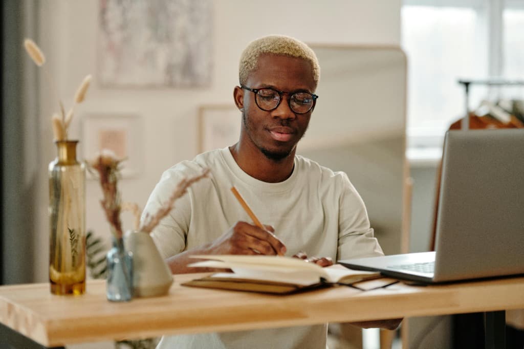 Creator working at desk with laptop